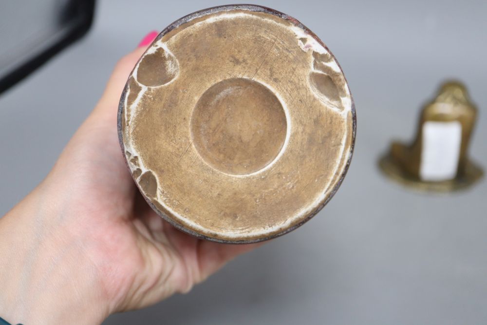 A sang de boeuf brush pot, height 15cm and a bronze deity